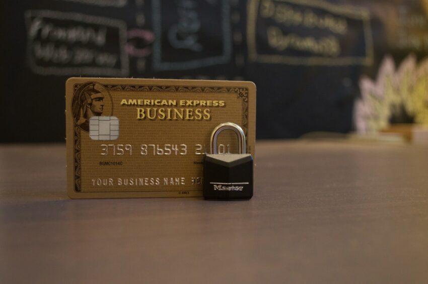 closeup photo of American Express Business card on brown surface